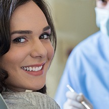 woman smiling dentist chair