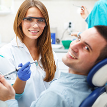 Smiling man in dental chair 