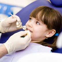 Child receiving dental treatment