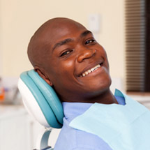 Smiling man in dental chair