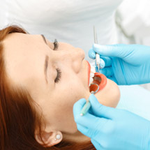 Woman receiving dental exam