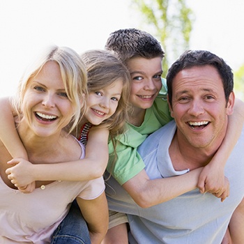 Smiling mother father  and two children