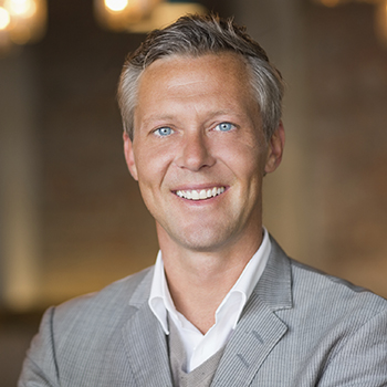 Joplin Cosmetic Dentist young man in suit smiling