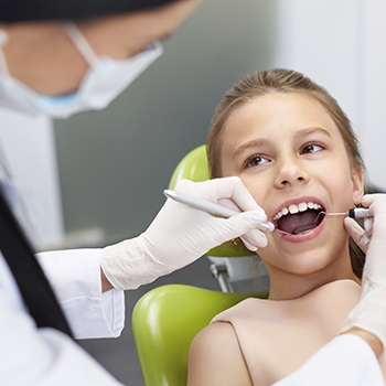 Joplin Preventive Dentistry dentist examining child patient