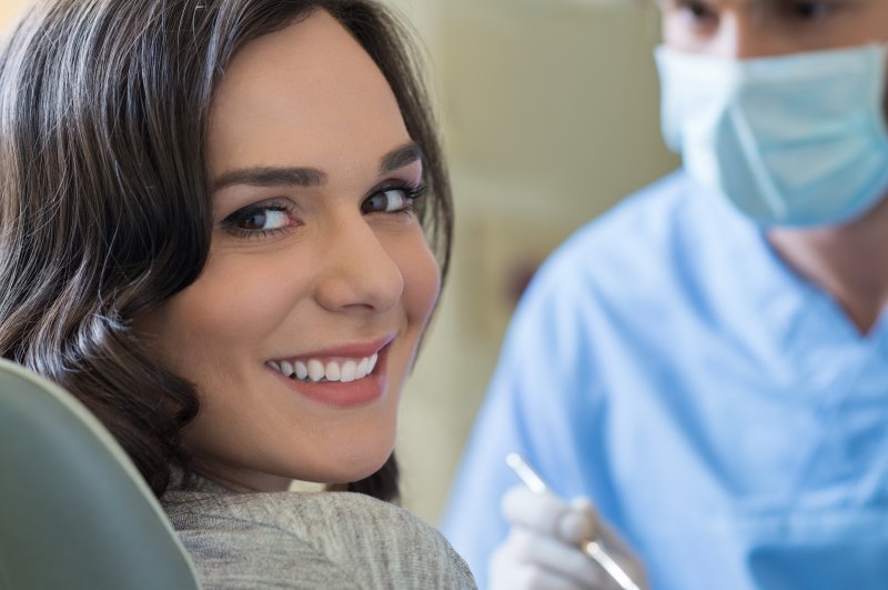 A woman smiling with a dentist in Joplin.